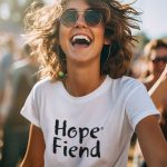 A woman in Hope Fiend tee shirt shows the concept that alcohol addiction and genetics do not define sobriety