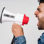 Man with SOBRLIFE.com megaphone embodies the Recover Out Loud Movement