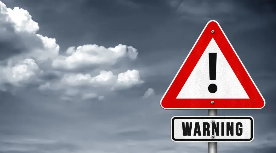 A triangular warning sign shows the concept of relapse warning signs from Sobrlife.com