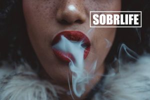 Smoking woman shows the concept of when substance use or abuse becomes a form of self soothing