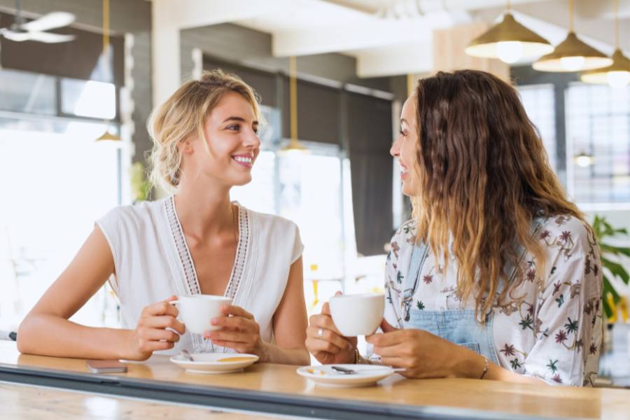 A female sober companion has coffee with her client in the morning in NYC